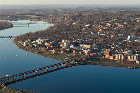 Aerial view of downtown Fredericton and the Saint John River in early morning light, New Brunswick