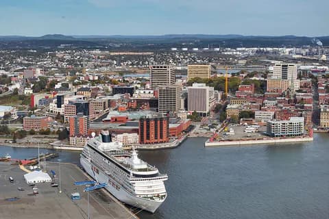 Uptown Saint John, New Brunswick, and its harbour with a cruise ship at the pier